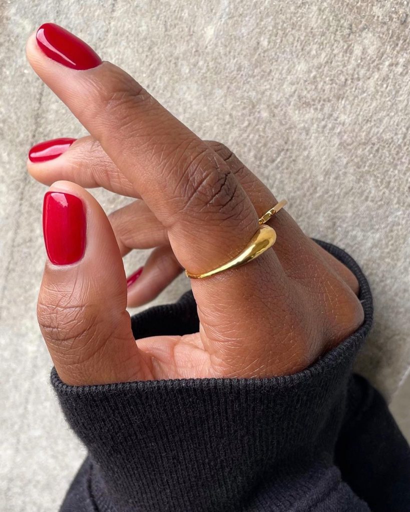 Simple and Classy: Classic Short Red Nails for Dark Skinned Women