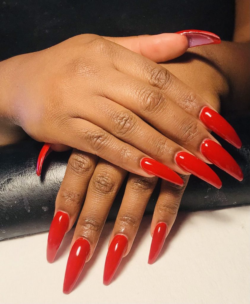 Simple and Classy: Classic Short Red Nails for Dark Skinned Women