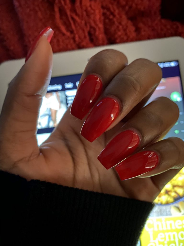 Simple and Classy: Classic Short Red Nails for Dark Skinned Women