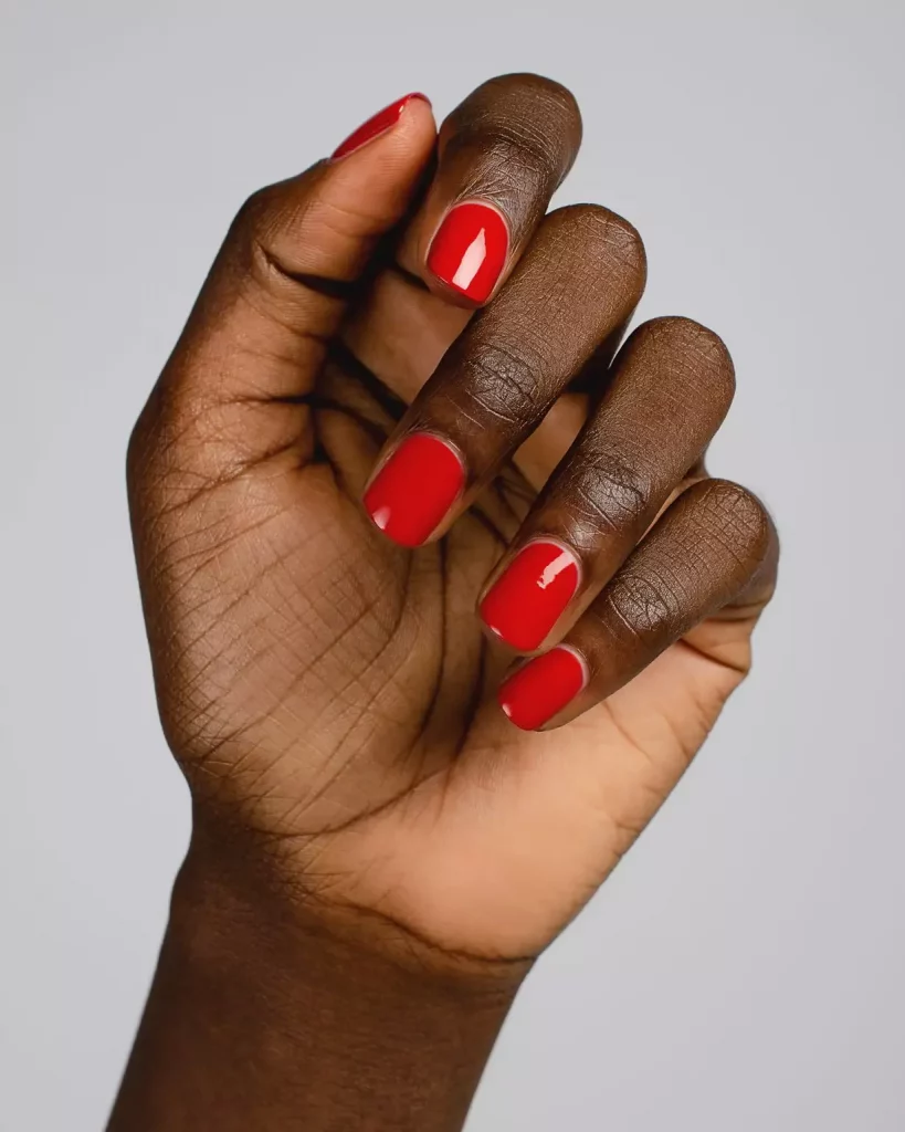 Simple and Classy: Classic Short Red Nails for Dark Skinned Women