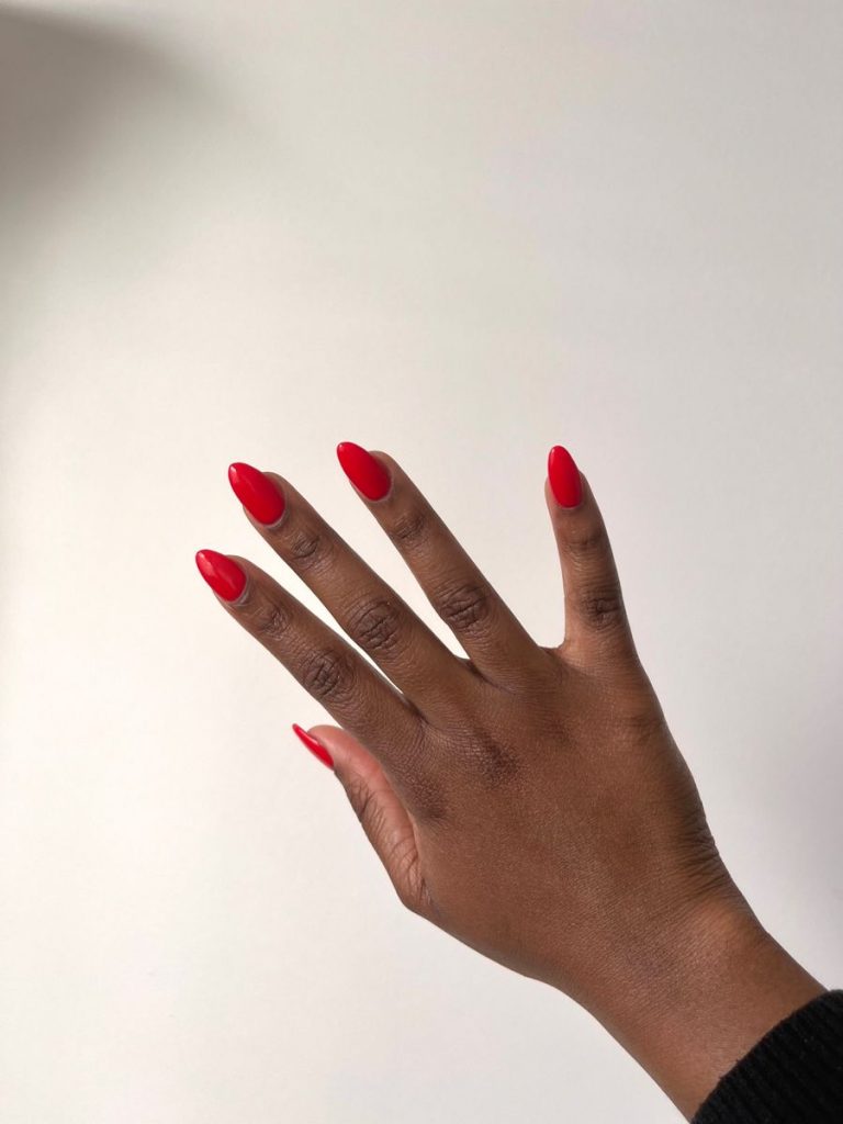 Simple and Classy: Classic Short Red Nails for Dark Skinned Women