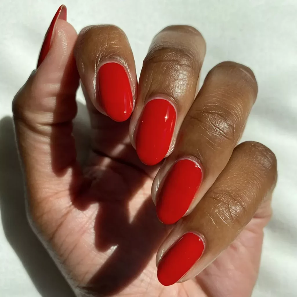 Simple and Classy: Classic Short Red Nails for Dark Skinned Women