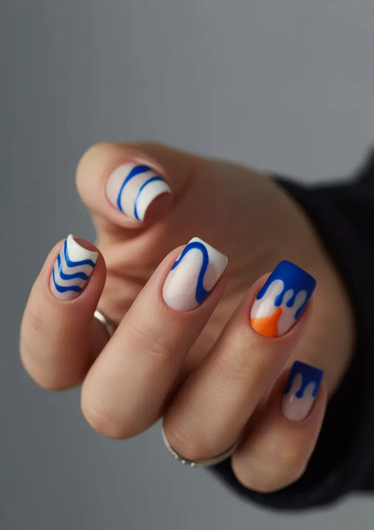 beach nails ideas 2025 Abstract Wave Art in White, Blue, and Orange