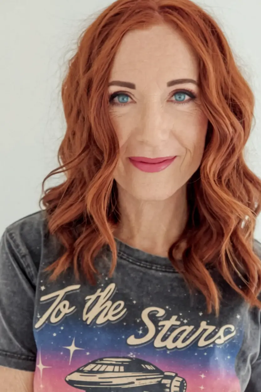 hairstyles women over 40 Fiery Red Waves for a Bold Autumn Vibe