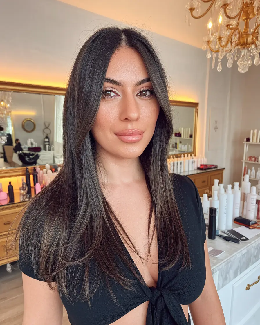 fall haircut for round face Polished Layers with a Clean Middle Part