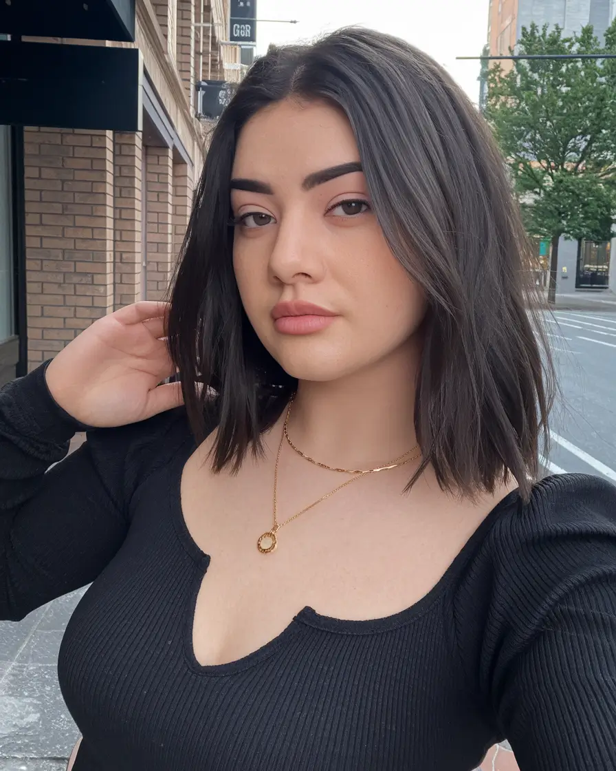 Fall 2025 hairstyles for Round Faces Blunt Dark Bob with Street Chic Vibe
