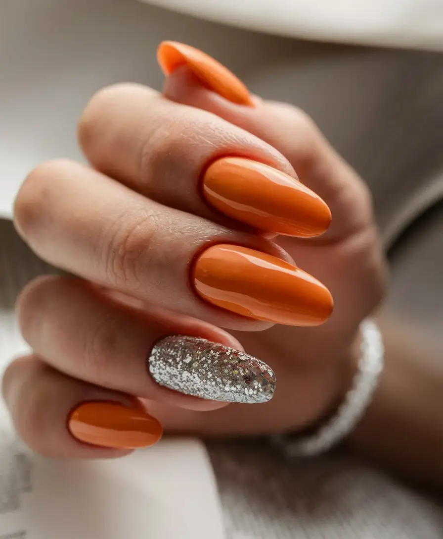 Early Fall Nails Ideas for 2025 Orange Pop with Glitter Accent