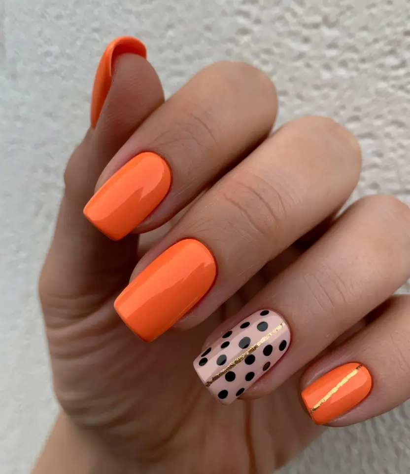 nail trends for fall 2025 Neon Orange and Polka Dot Square Nails