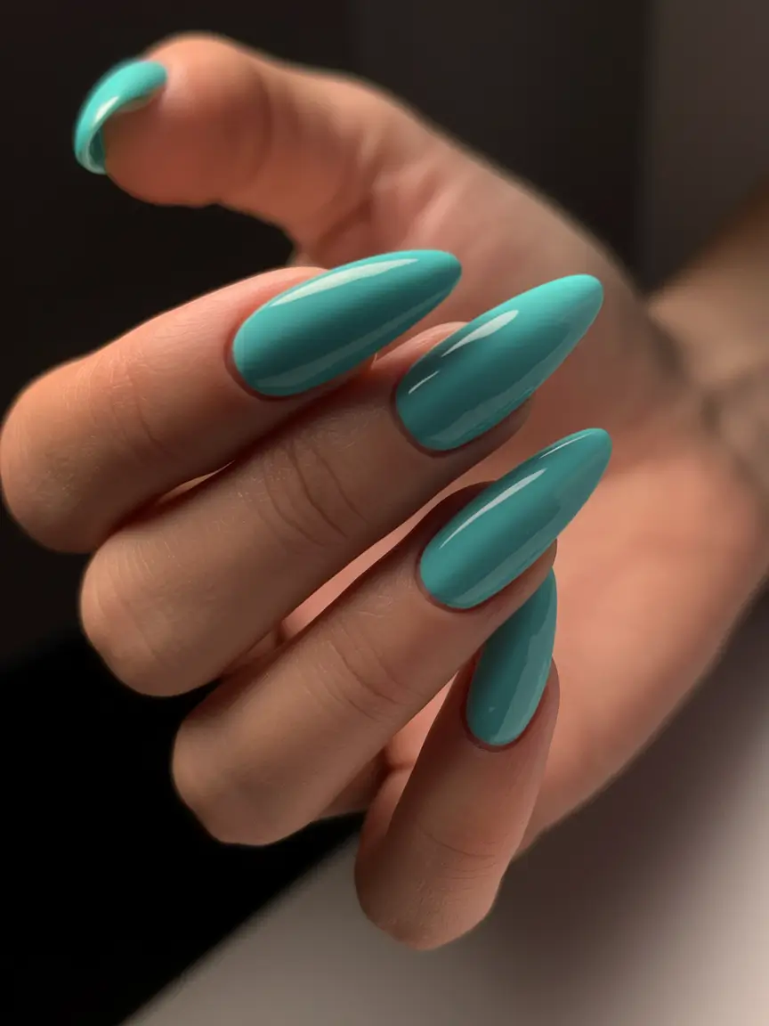 nail trends for fall 2025 Glossy Teal Almond Nails