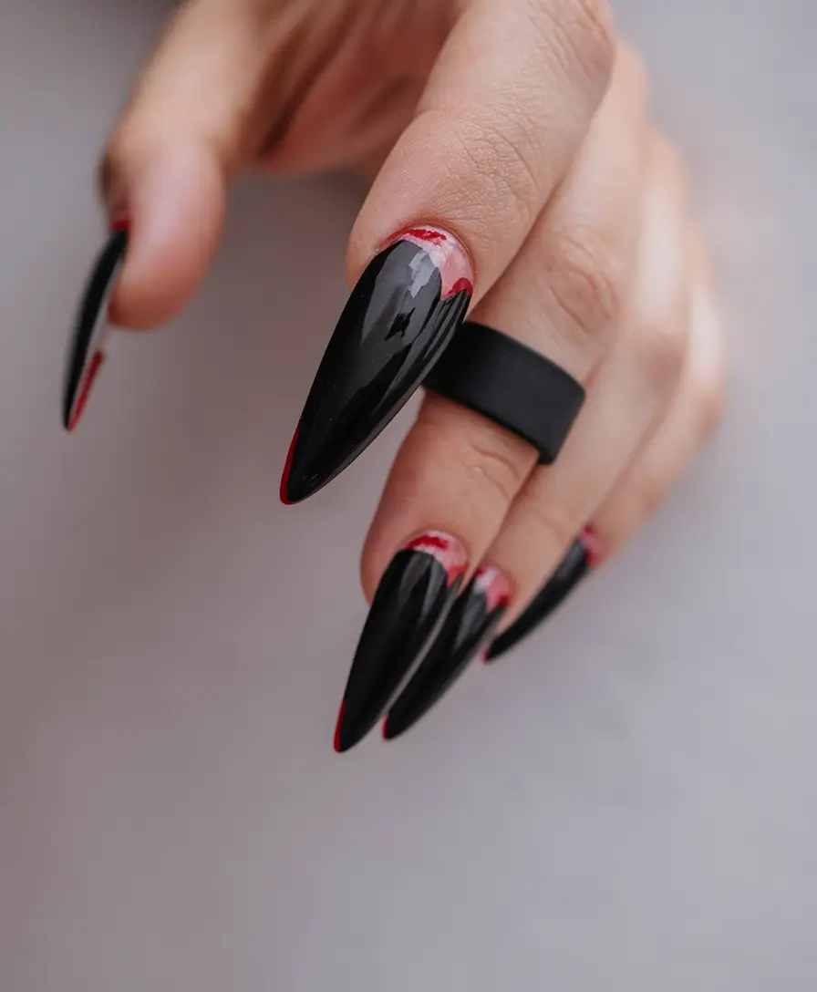 nail trends for fall 2025 Black and Red Vampire Stiletto Nails