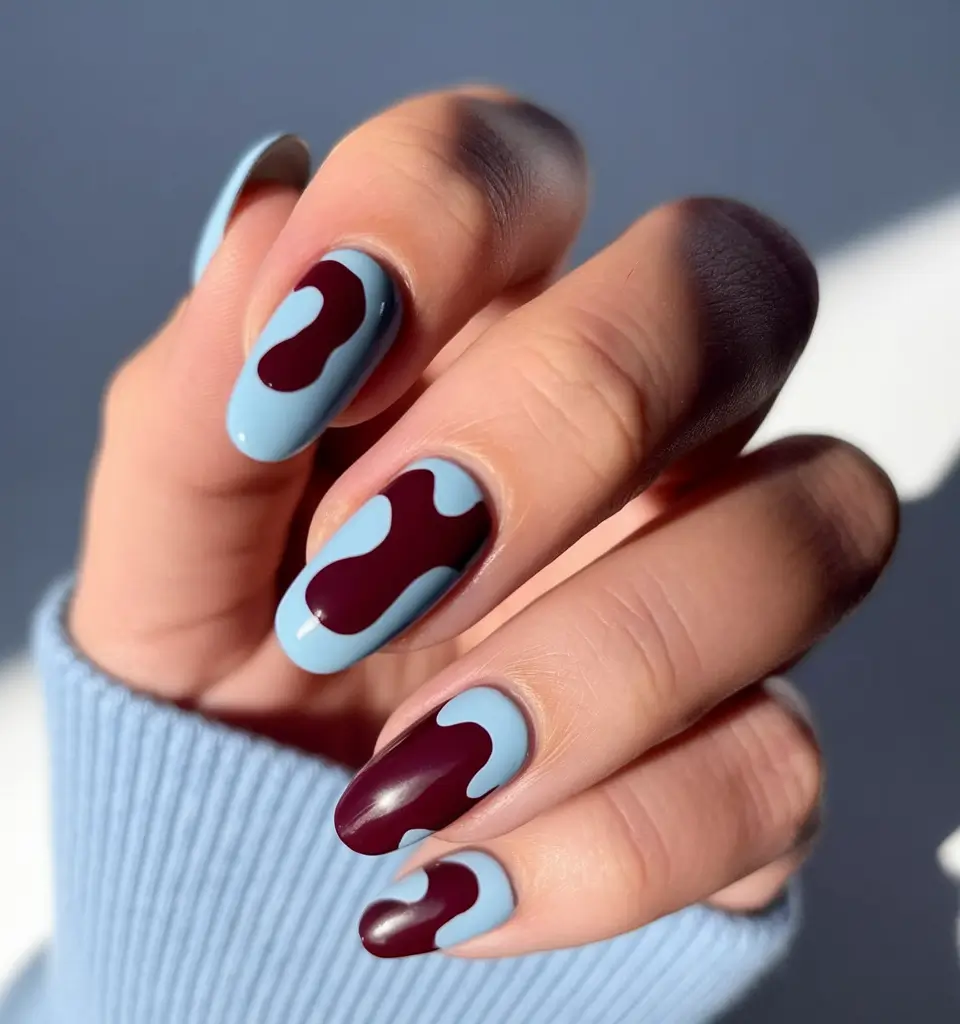 nail trends for fall 2025 Sky and Merlot Abstract Almond Nails