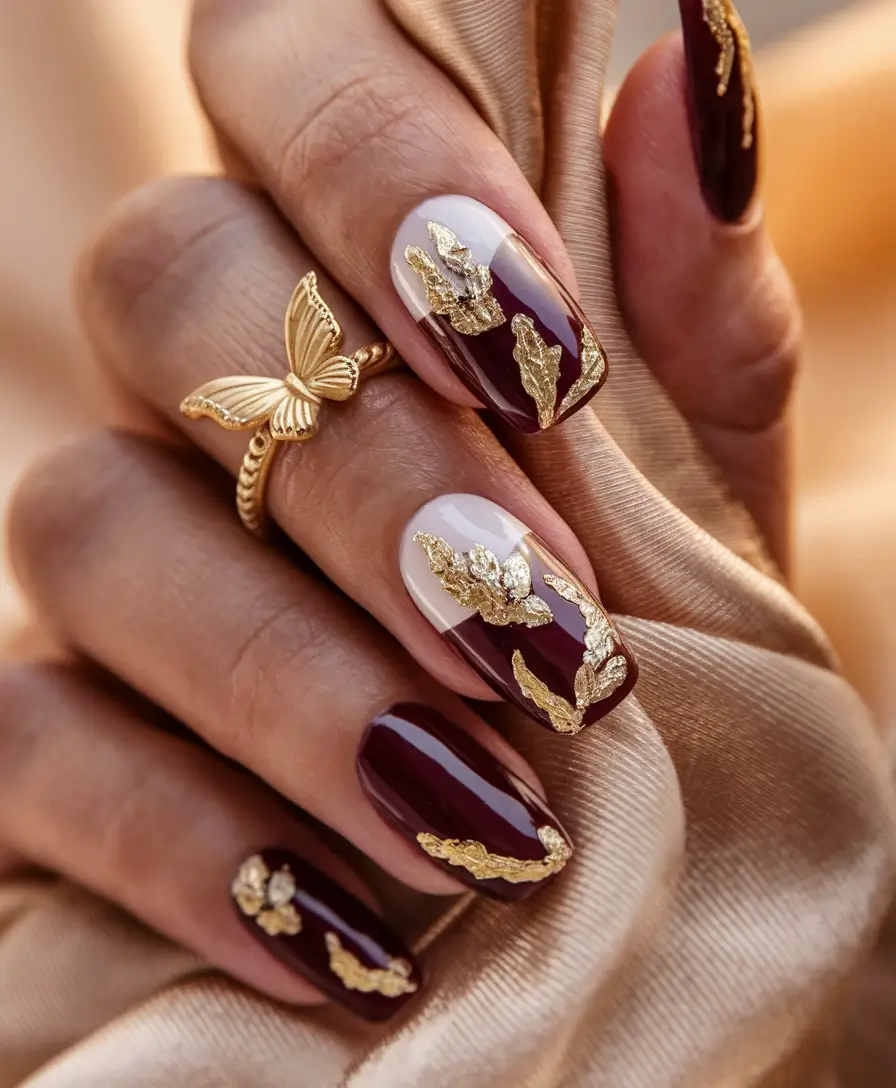 Stylish Brown Fall Nails 2025 Wine Red with Golden Leaf Accents