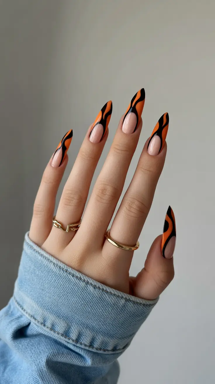 Elegant almond nails 2026 Black & Orange Flame Art for Edgy Expression
