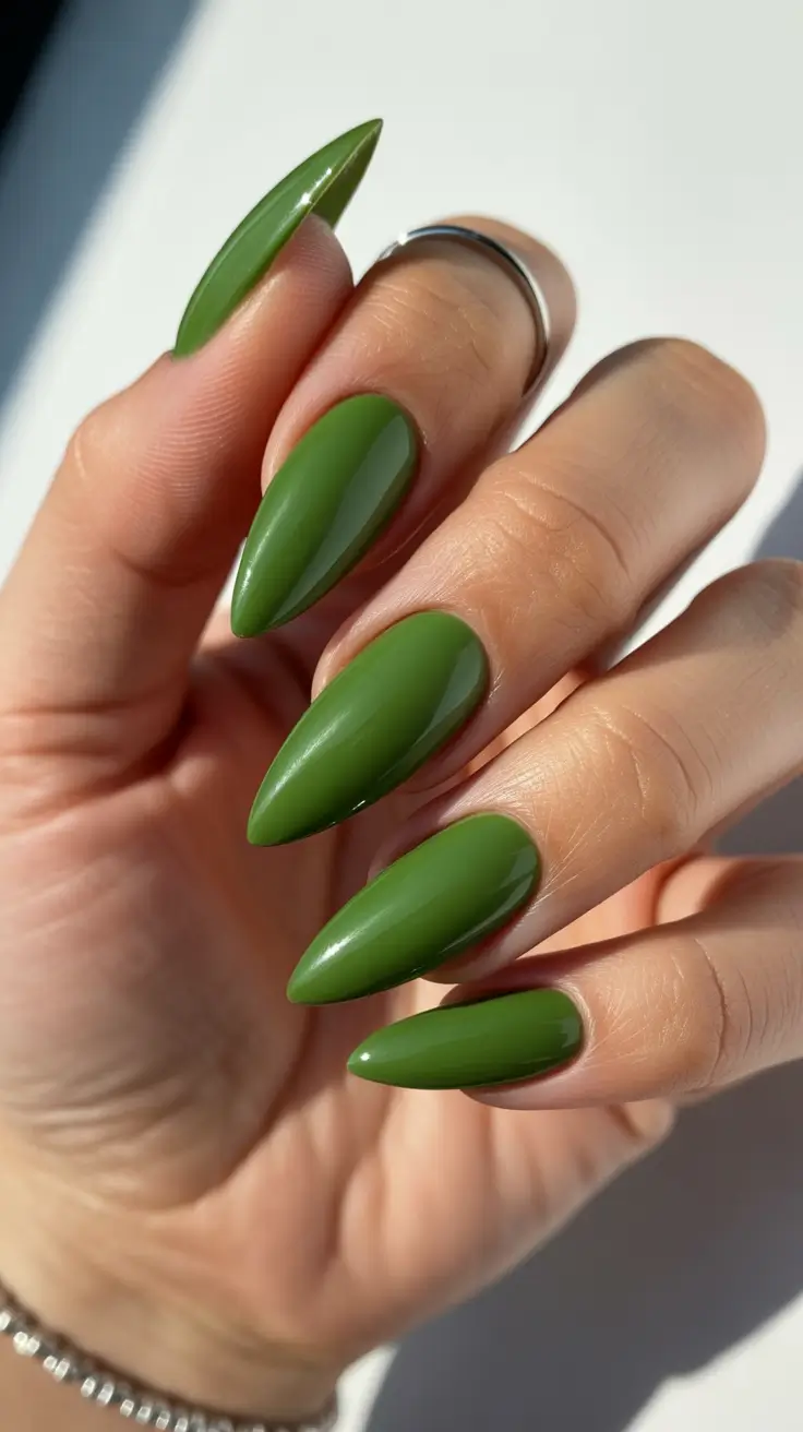 Elegant almond nails 2026 Deep Botanical Green for Bold Clean Lines