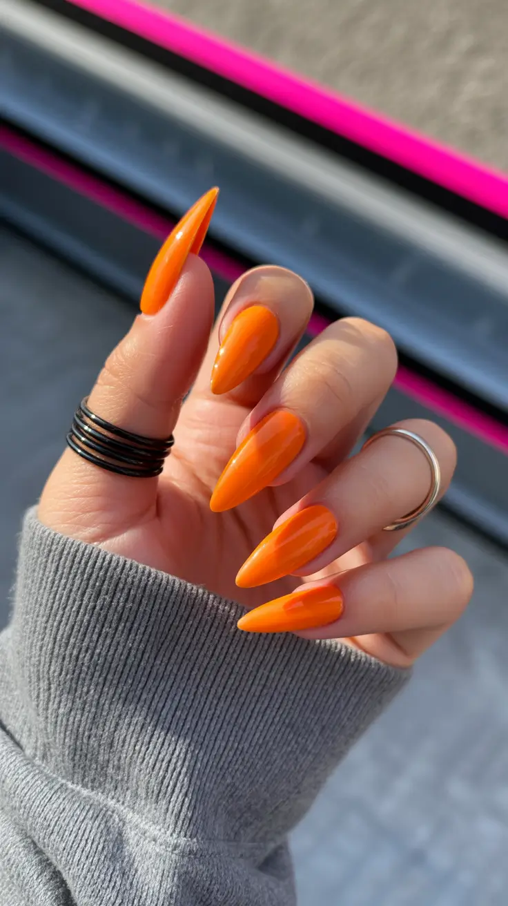 stiletto nail designs 2026 Tangerine Neon Burst