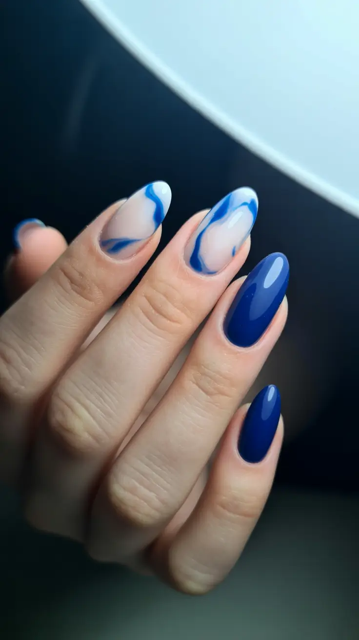 modern trendy spring nails 2026 Electric Blue Waves on Almond Perfection