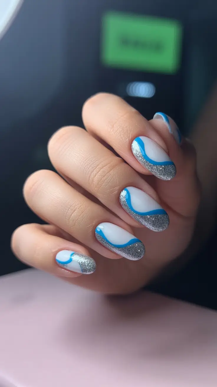 modern trendy spring nails 2026 Silver-Tipped Blue French with Graphic Waves