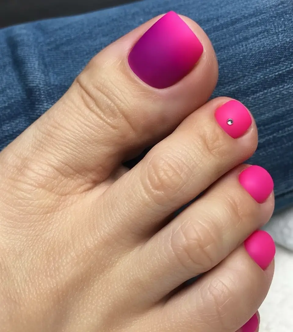elegant spring toe nails 2026 Matte Hot Pink Pedicure with Crystal Accent