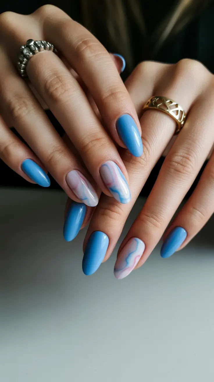 modern spring oval nails 2026 Dreamy Sky Blue Marble Movement