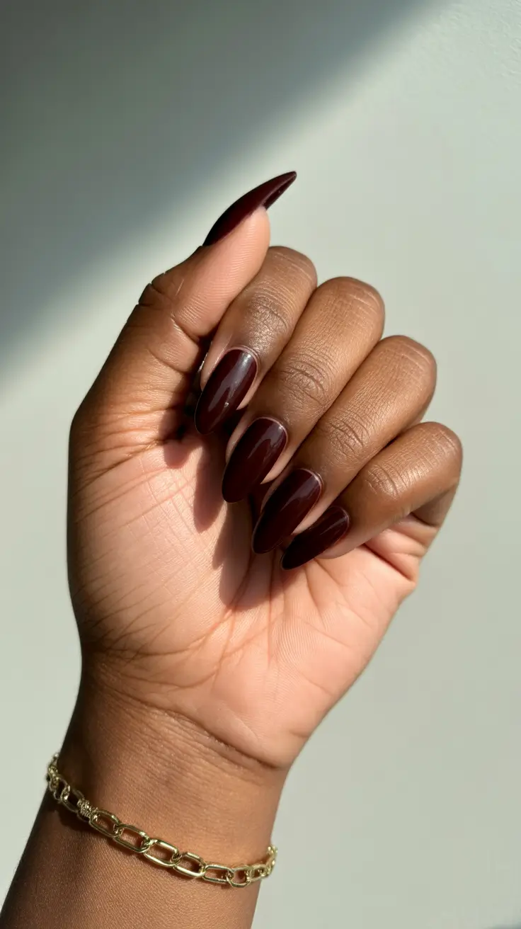 stylish spring nails for dark skin 2026 Deep Chocolate Almond Nails That Add Sophisticated Drama