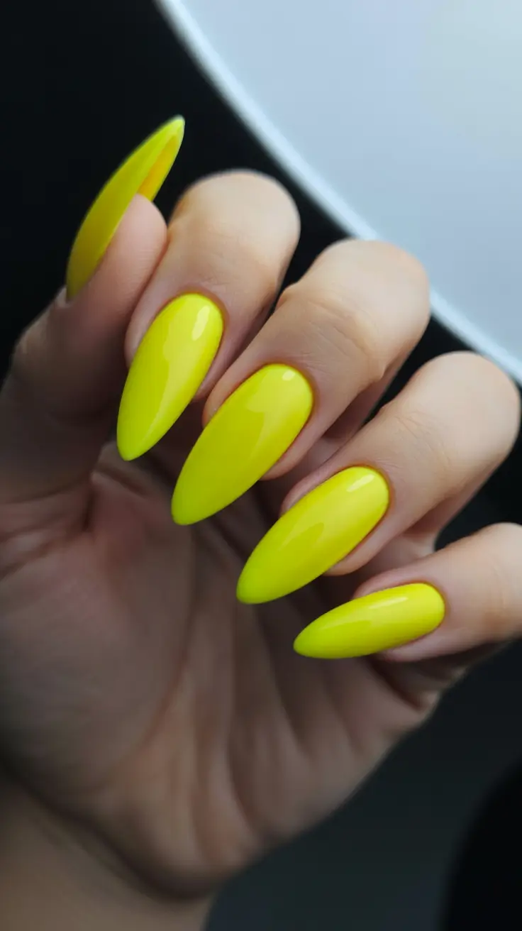 trendy spring almond nails 2026 High-Voltage Neon Yellow Almond