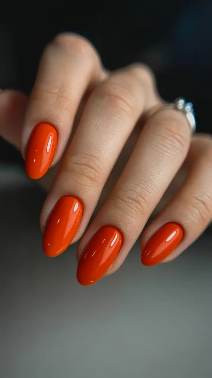 trendy spring almond nails 2026 Glossy Tangerine Almond for Bright Spring Energy