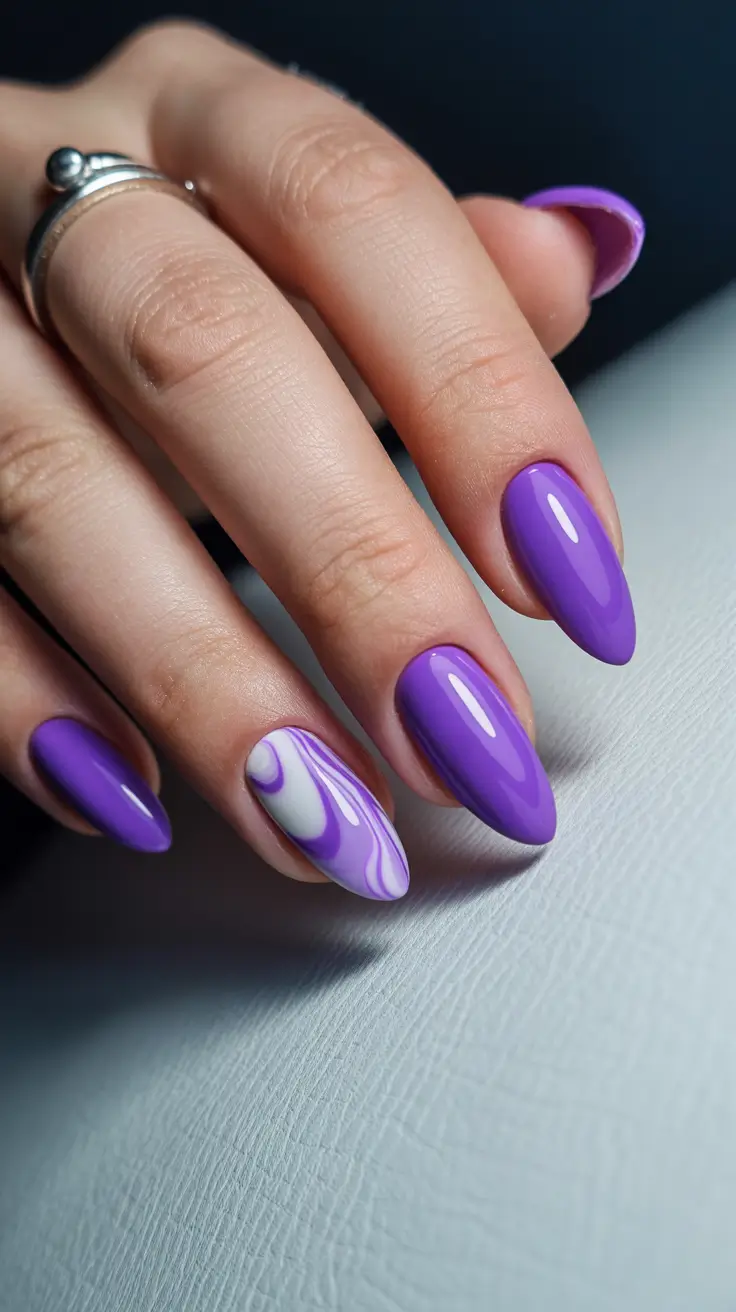 trendy spring almond nails 2026 Vivid Purple Almond with Swirl Art Detail