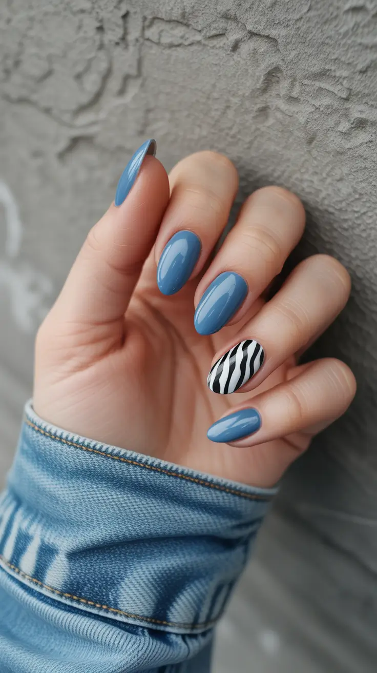 trendy spring almond nails 2026 Dusty Blue with Graphic Zebra Accent