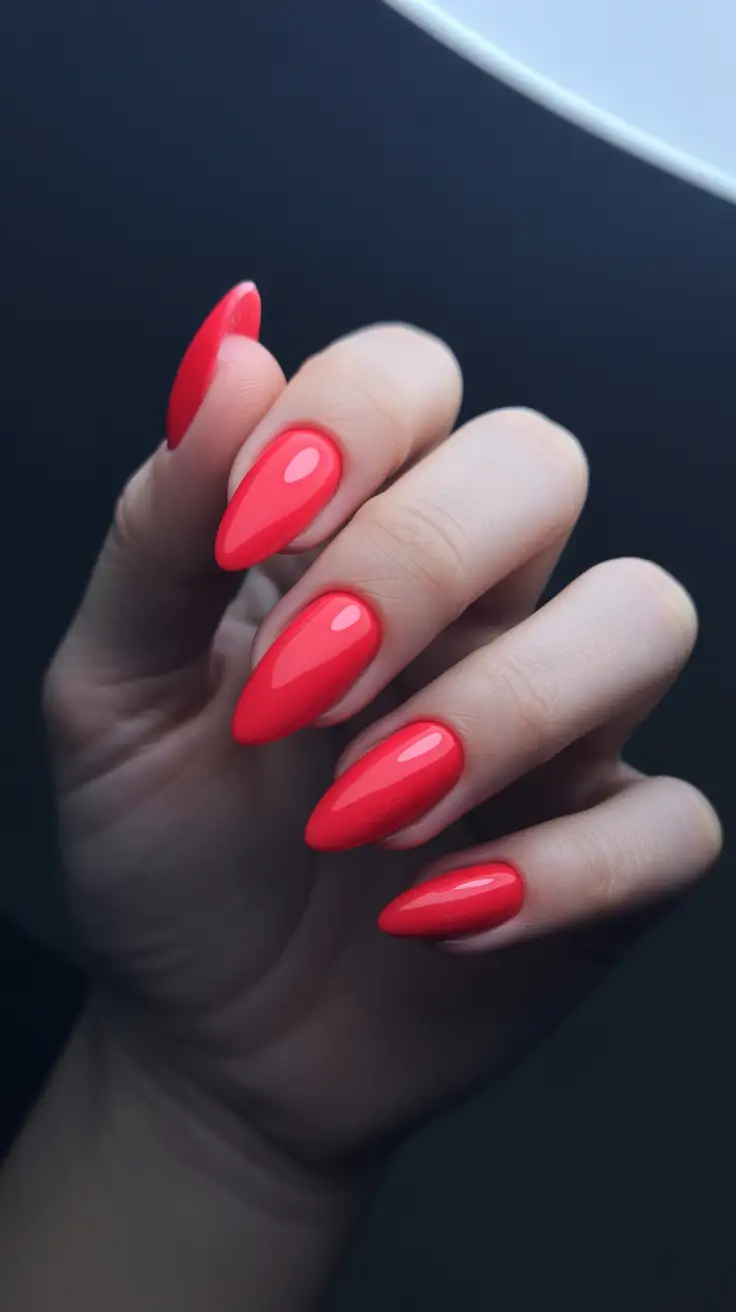 trendy spring almond nails 2026 Coral Red Almond for Modern Spring Boldness
