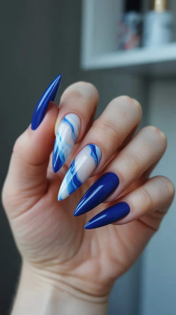 trendy spring vacation nails 2026 Bold Royal Blue Marble Almond for Statement Sightseeing
