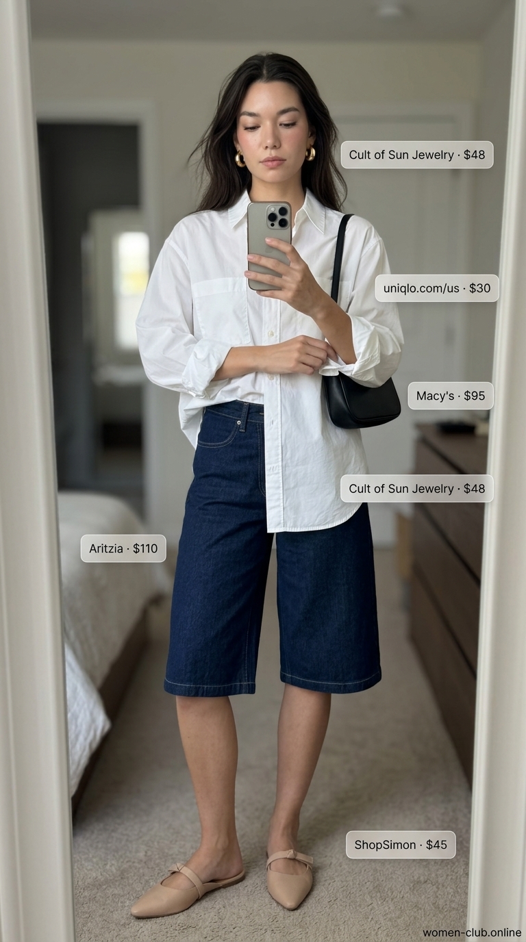Versatile every day summer outfits for women 2026: Indigo shorts, white shirt, gold hoops for city exploration.