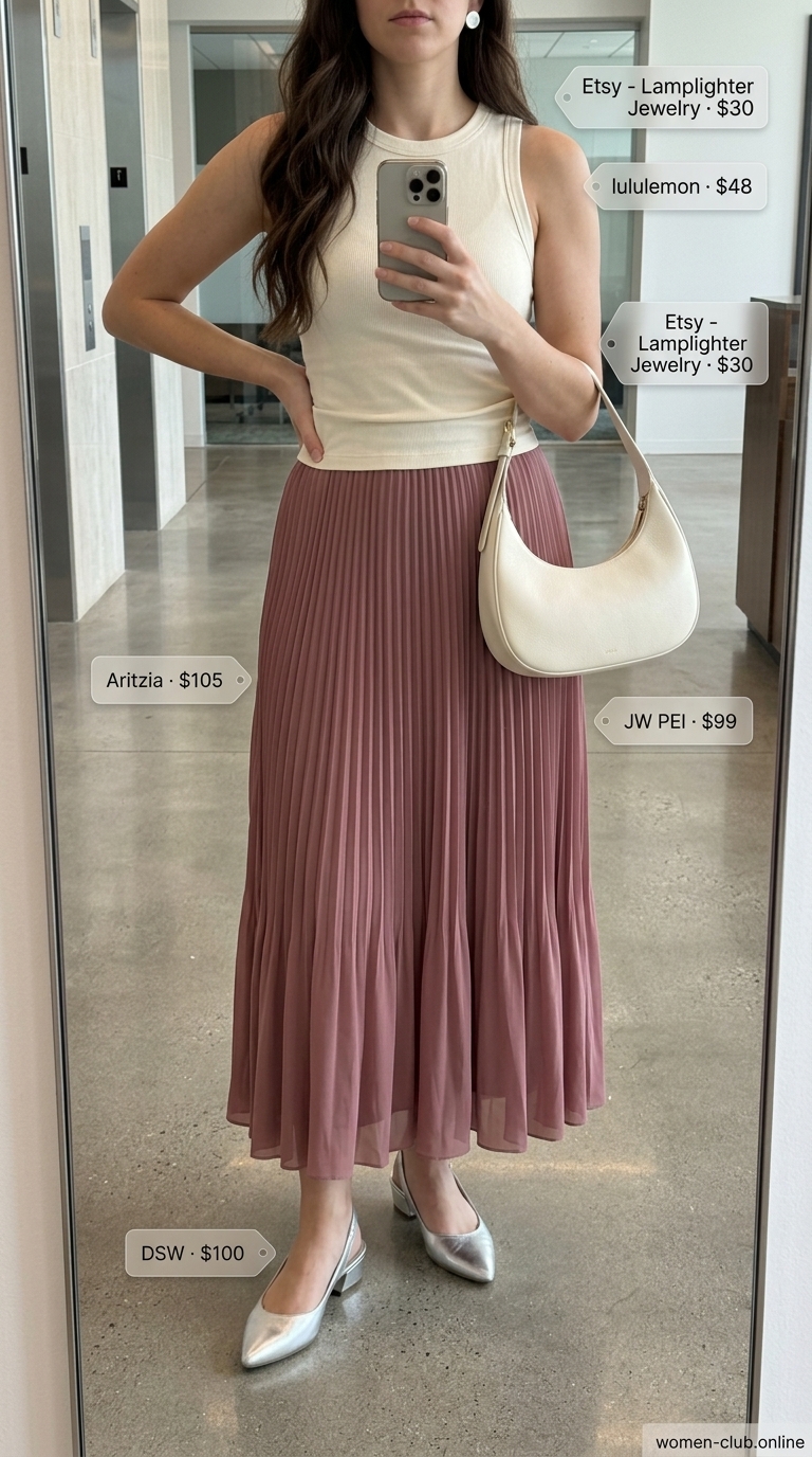 Dusty rose pleated midi skirt, ivory knit top, and silver pumps for a summer business casual outfit for women 2026.