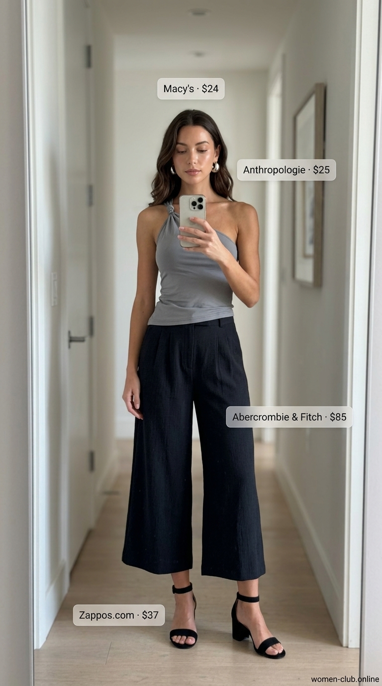 Black crepe pleated summer tailored culottes for women 2026 styled for an evening gallery opening.