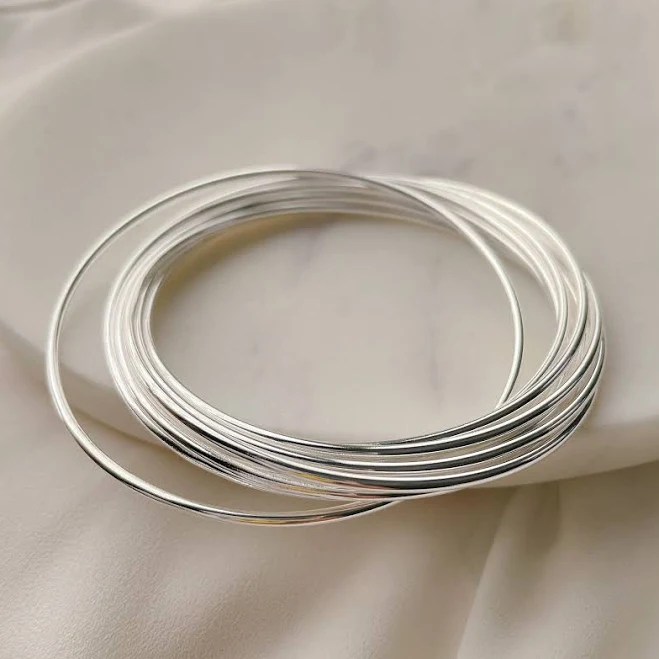 Sterling Silver Interlocking Bangle Set with 9 Thin Round Stacking Bracelets