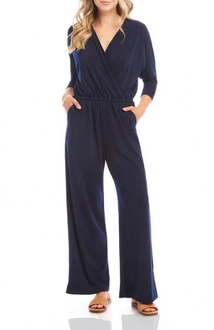 Plus size soft knit wide-leg jumpsuit with V-neck and adjustable tie waist