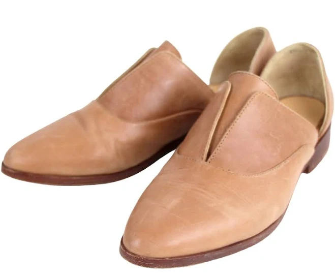 Flat genuine leather slide sandals with braided details