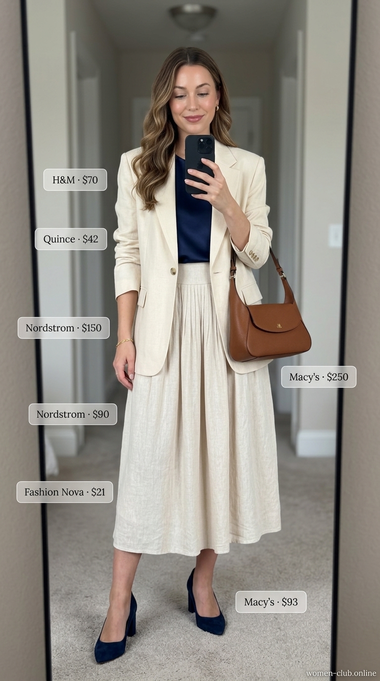 Sophisticated Summer Linen Outfits 2026: Linen Suit Polished summer linen outfits for women over 30 2026: Cream linen suit, navy silk top, tan bag & block heels for events.