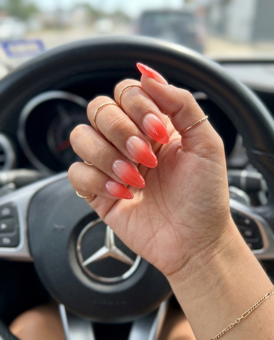 Easy summer nails 2026: Bright coral jelly ombre on medium almond nails for vacation glam.