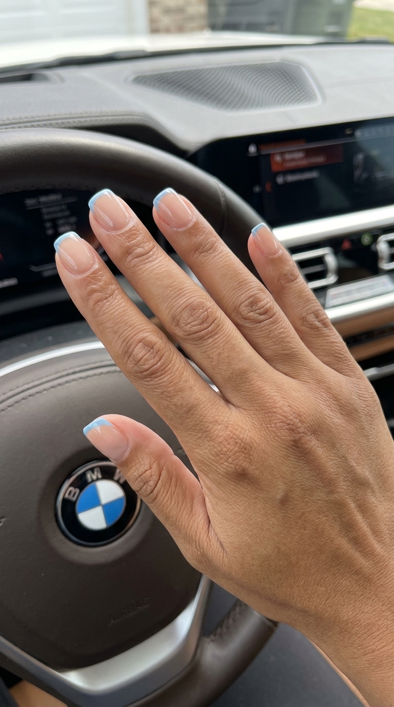 Easy Summer Nails 2026: Icy Blue Micro French Easy summer nails 2026: Glossy icy blue micro French tip on short square nails for a polished look.