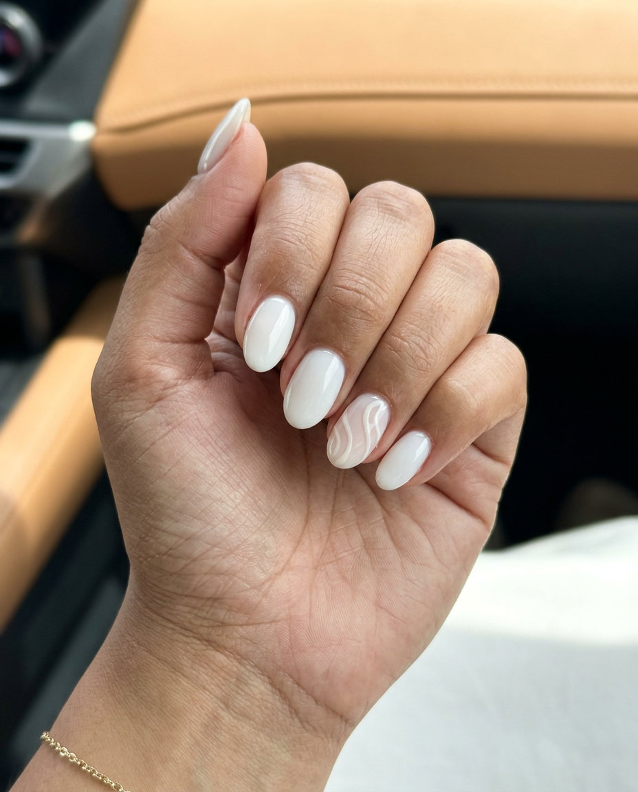 Milky White Swirl Accent Nails: Minimalist chic work nails with subtle nude/white abstract swirls. June nails ideas - summer ideas 2026.