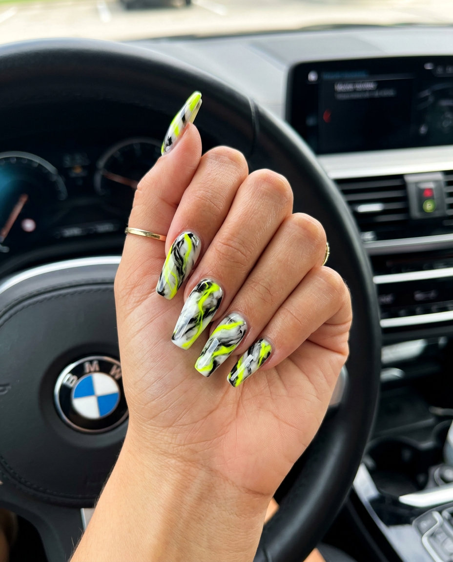 Electric Lime Abstract Swirls Nails 2026 Electric lime abstract swirls on black nails for festivals, an edgy neon summer nails 2026 look.