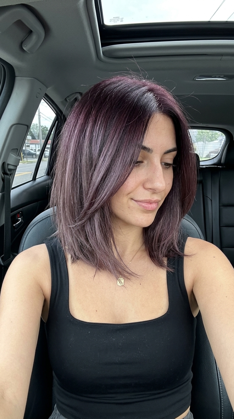 textured bob haircut with cool plum-violet to ash-burgundy color melt, smoky mysterious finish
