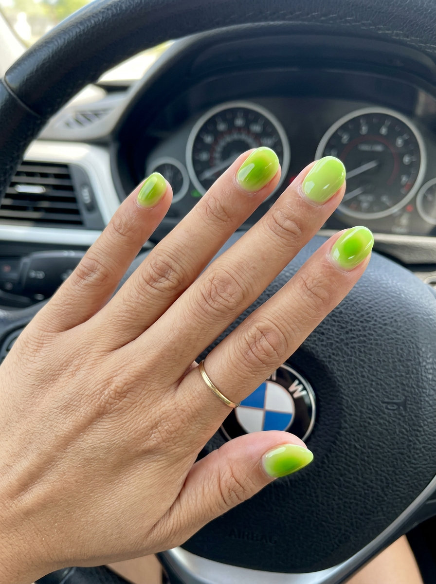 Lime green jelly aura accent short round nails 2026 for summer vacation and festivals. Playful vibe.