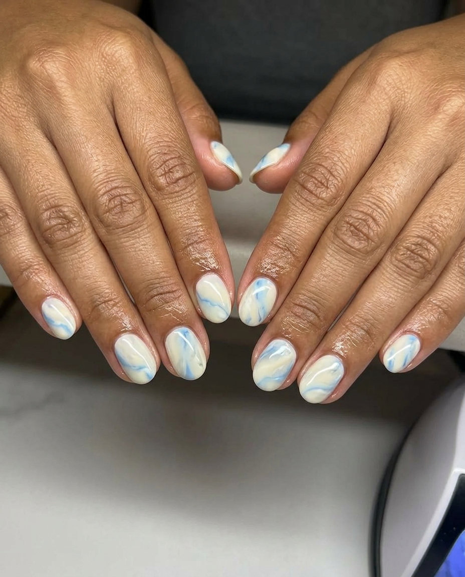 Sophisticated Coastal Marble Nails 2026 Coastal marble mix short nails for casual, relaxed events, and vacation. Simple short summer nails 2026.