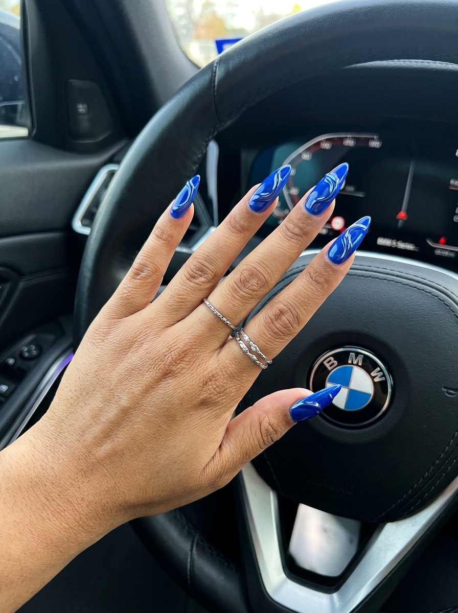 Glamorous Sapphire Stiletto 3D Chrome Sculptures for stiletto summer nails 2026. Futuristic party look.