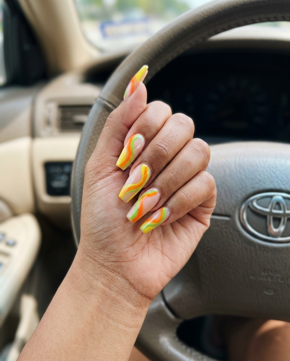 Summer colorful nails designs 2026: Abstract citrus swirls for summer festivals and parties.