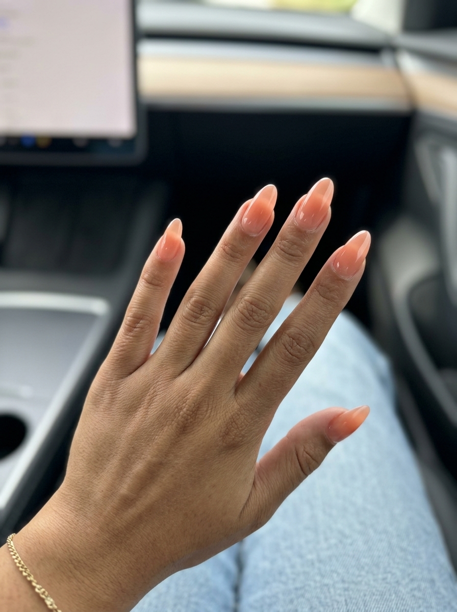 Juicy Peach Jelly Ombre Nails 2026 | Vacation Style Juicy Peach Jelly Ombre almond nails for summer nail manicure ideas 2026. Sheer peach gradient, glowy, effortless vacation style.