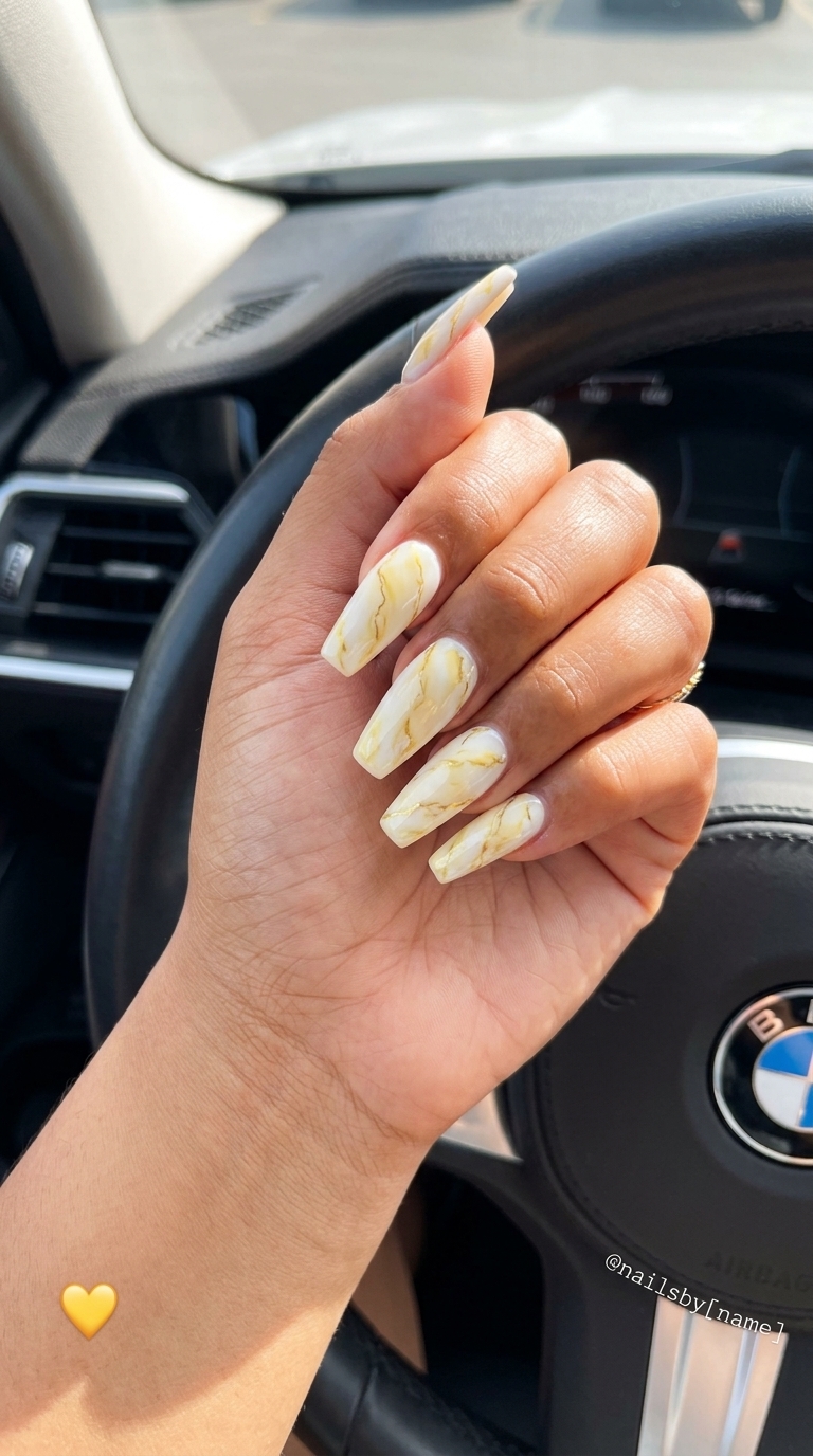 Butter Yellow Marble Coffin Nails 2026 Butter Yellow Marble Coffin nails: elegant creamy white with butter yellow marble and gold veins for formal events. Summer nails yellow 2026.