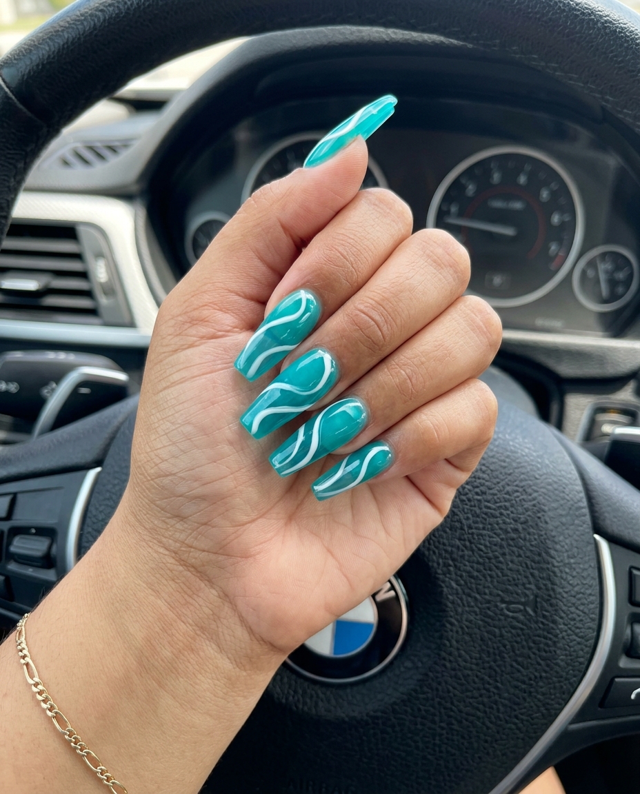 Trending Summer Nails 2026: Vibrant Teal Jelly Swirls Vibrant Teal Jelly Swirls nails for festivals 2026: playful edgy translucent design.