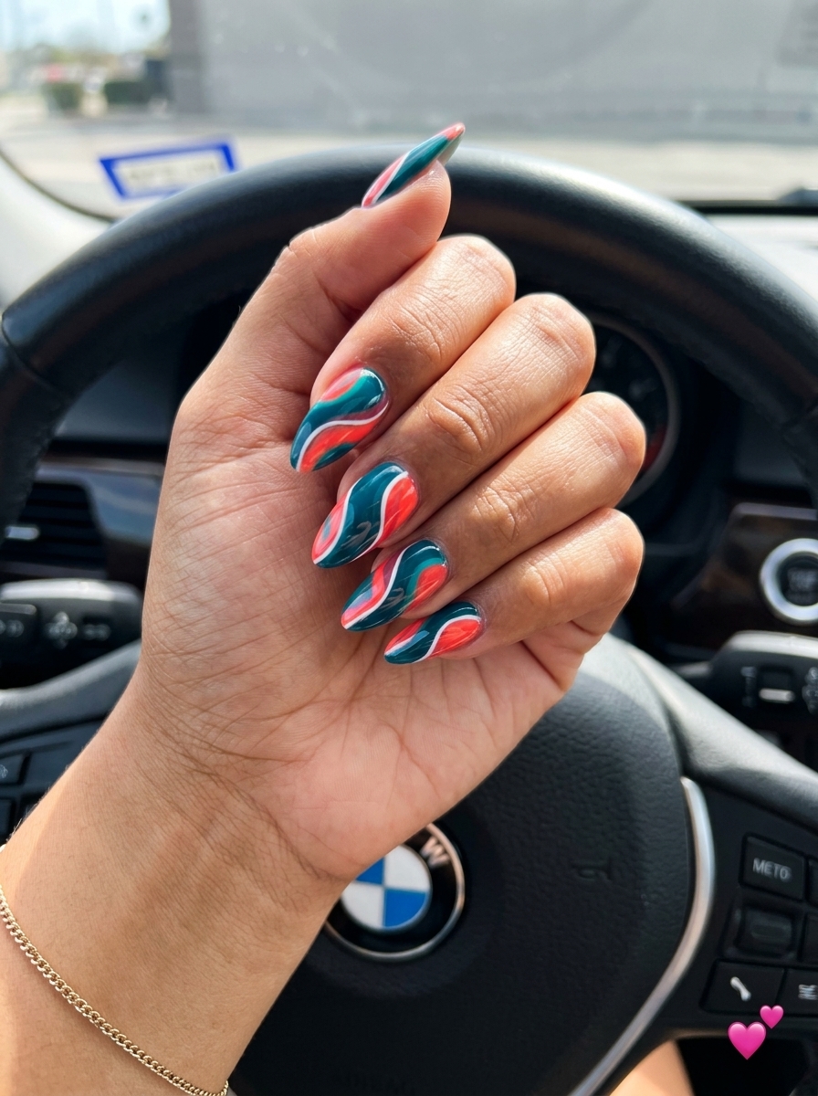 Teal and Coral Swirls Almond nails for tropical nail designs 2026, perfect for vacation or bohemian events.
